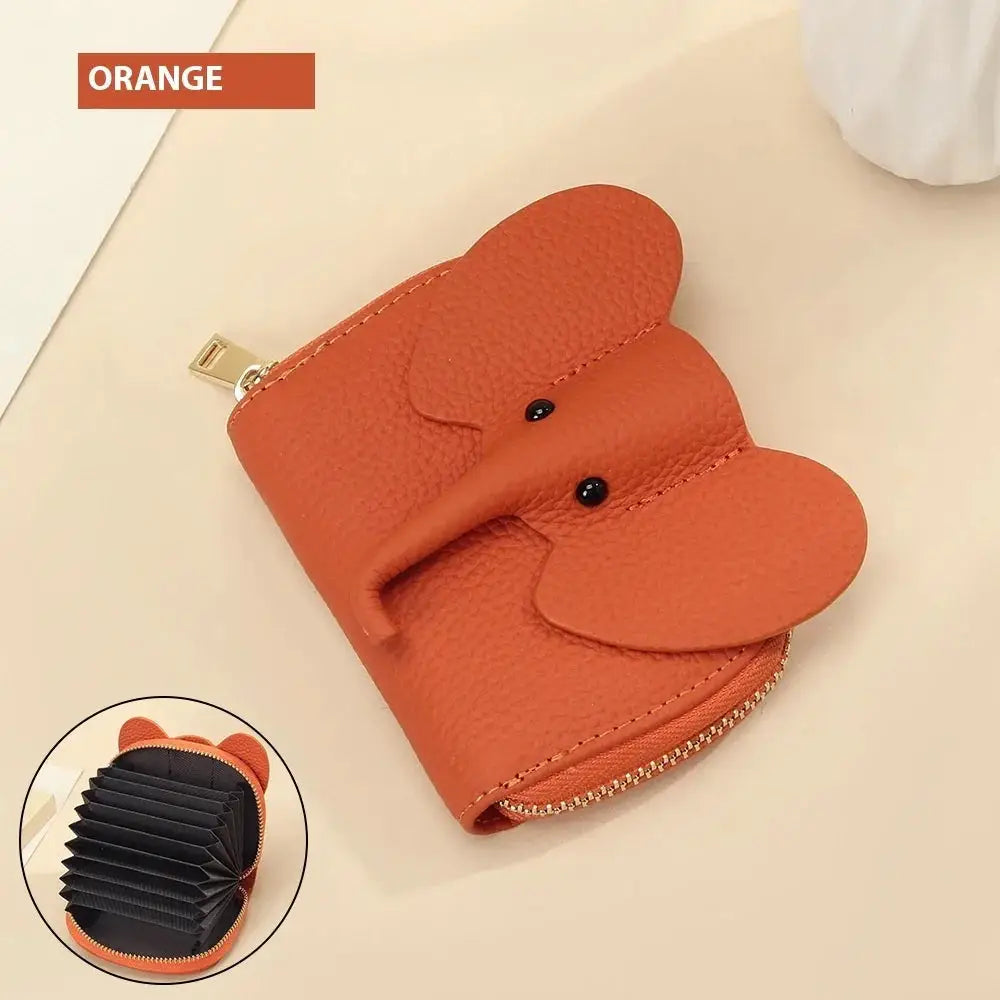 Orange elephant leather accordion card holder wallet with textured finish black bead eyes and gold zipper