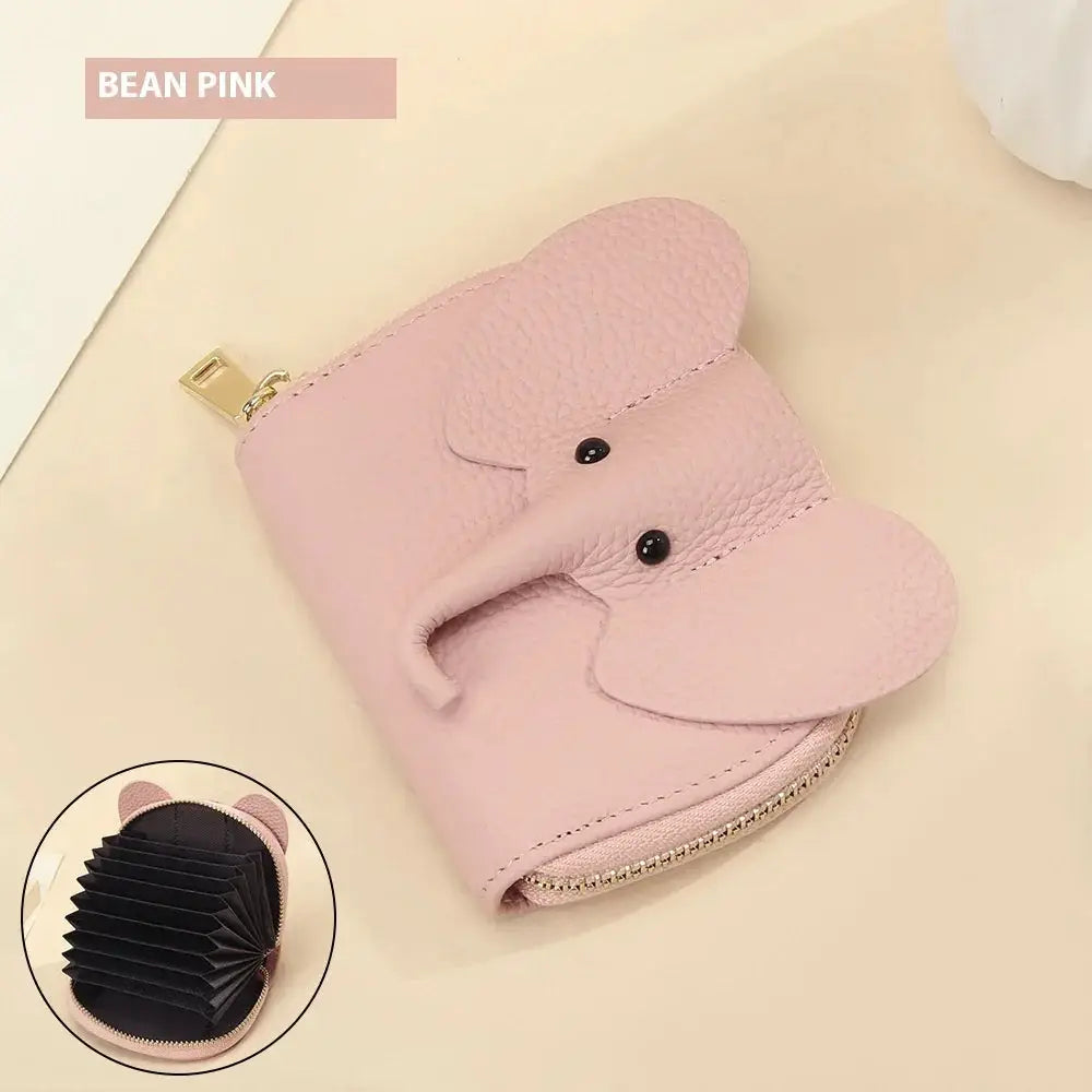 Elephant leather accordion card holder wallet in soft pink with black bead eyes and gold zipper closure