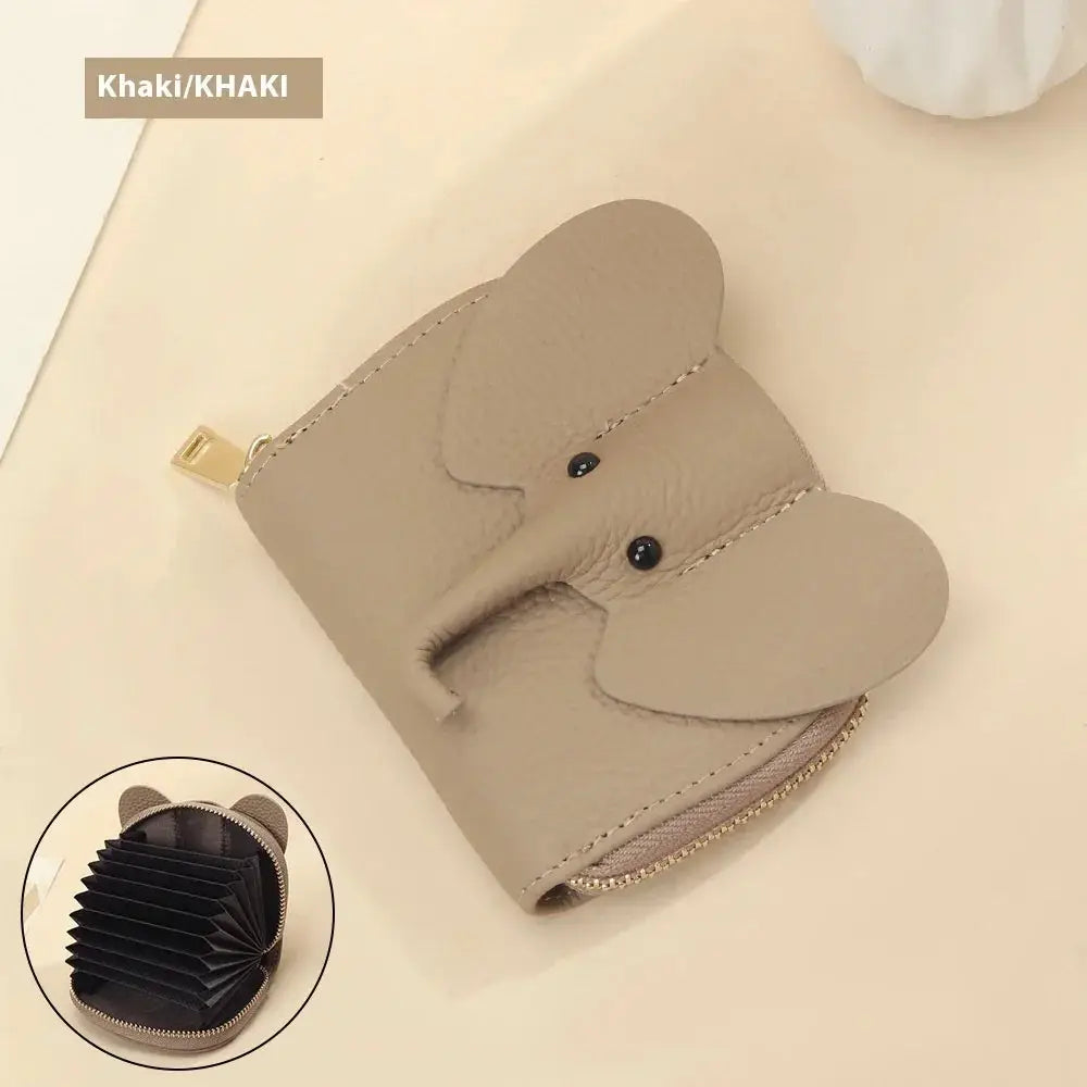 Khaki-colored elephant leather accordion card holder wallet with black bead eyes and a gold zipper closure