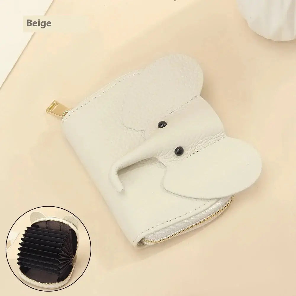 Beige elephant leather accordion card holder wallet with black button eyes and a gold zipper closure