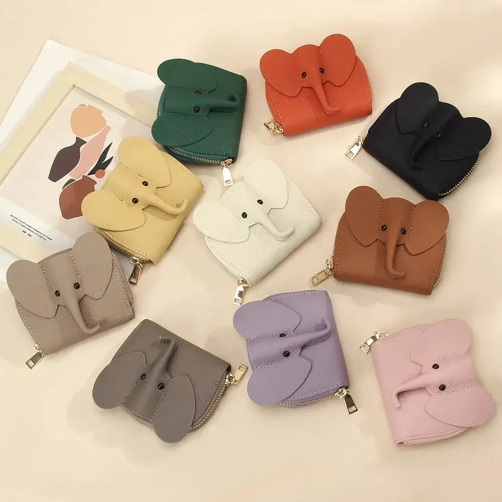 A collection of colorful elephant leather accordion card holder wallets in green orange navy beige white brown gray purple and pink
