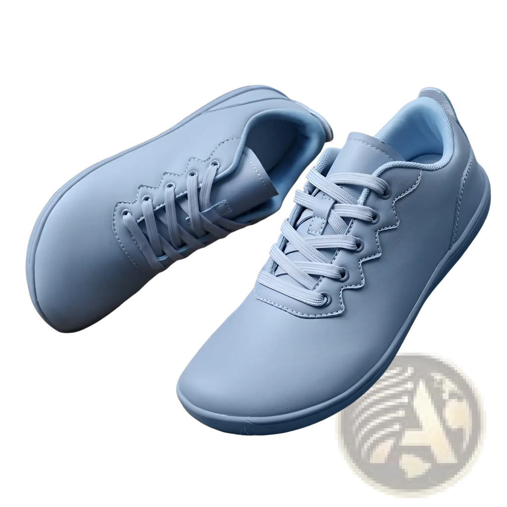 Light blue leather outdoor sneakers with matching laces and scalloped edge design for minimalist casual wear