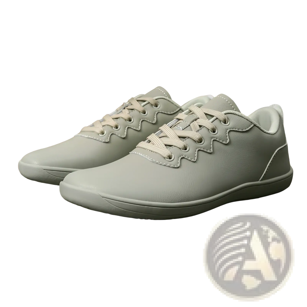 Light gray leather outdoor sneakers with matching laces and a subtle wave pattern along lace eyelets for casual wear