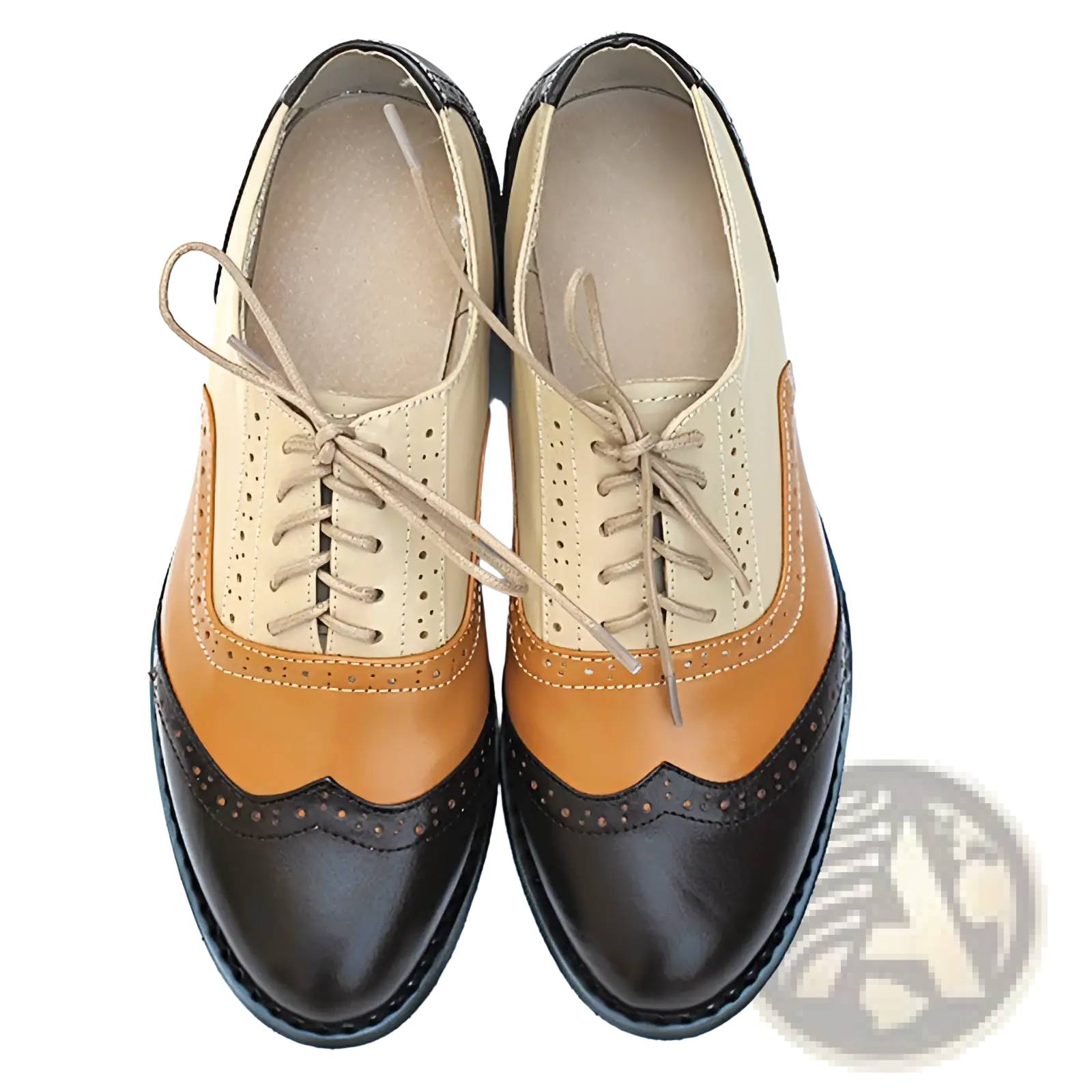 A pair of women’s leather oxford brogue shoes in beige tan and black with decorative perforations and stitching
