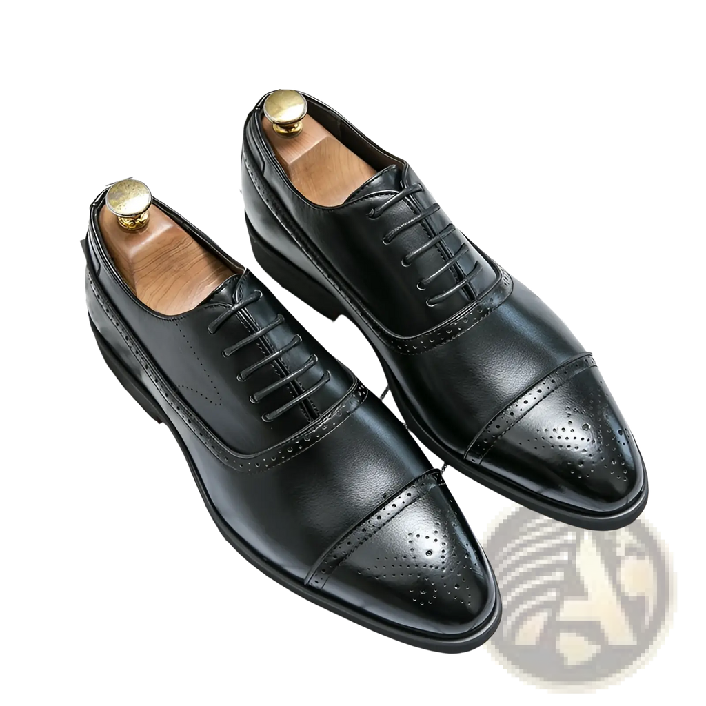 Black leather oxford shoes with polished finish and decorative brogue detailing for men’s business casual wear
