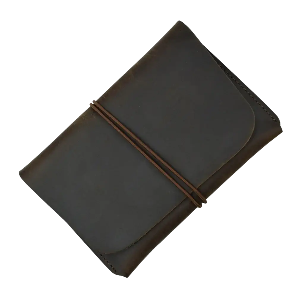 Dark brown leather passport holder travel wallet with minimalist design and two matching leather strap closures