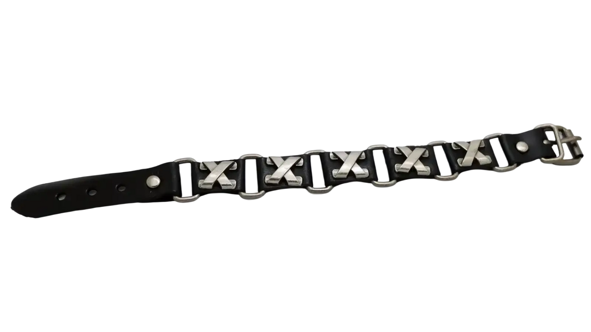 Black leather punk bracelet with silver x-shaped metal links and matching buckle for edgy fashion accessory