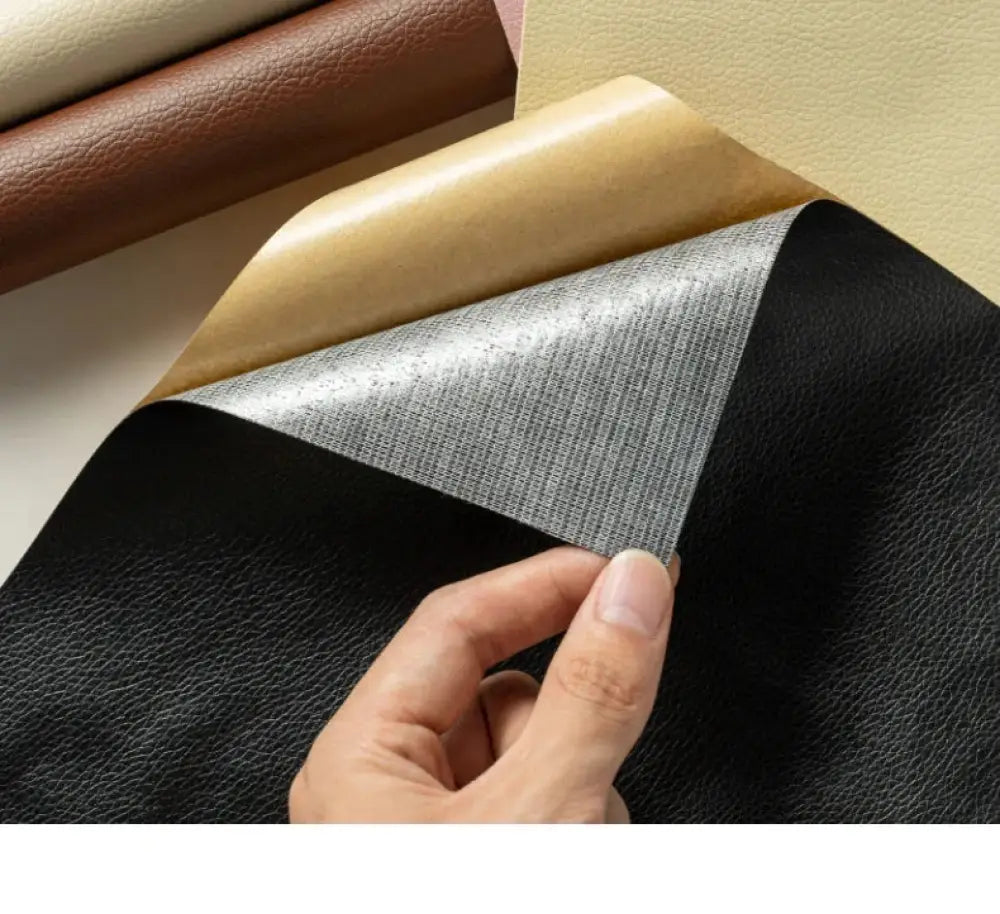 Black self adhesive pebbled leather repair patch roll showing black faux leather with textured surface and silver backing