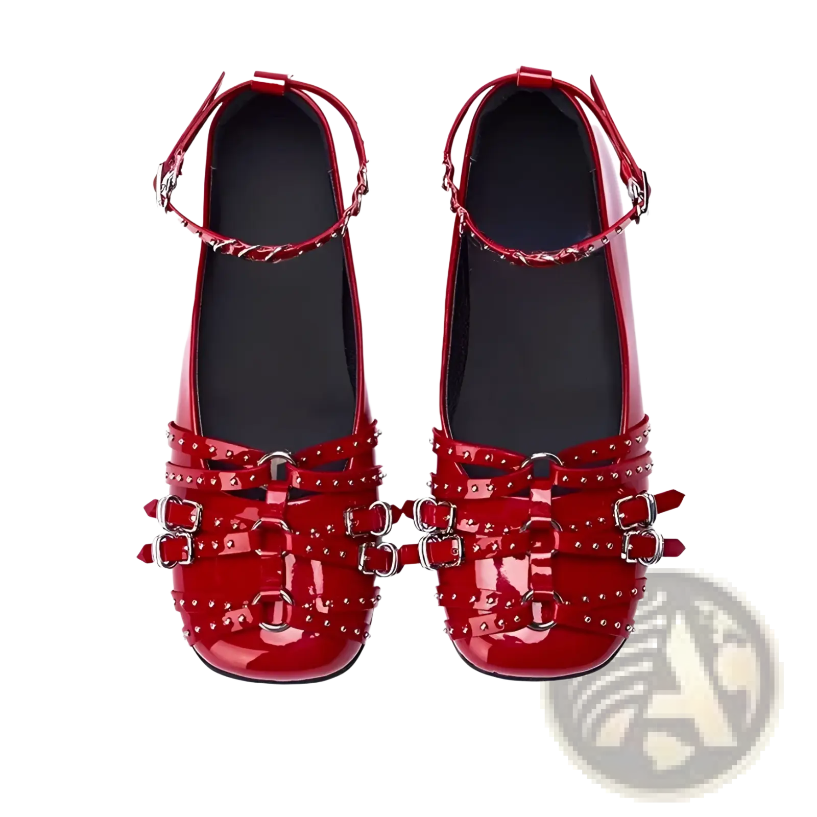Red patent leather retro pumps with silver toned studded buckle straps showcasing elegant flat design