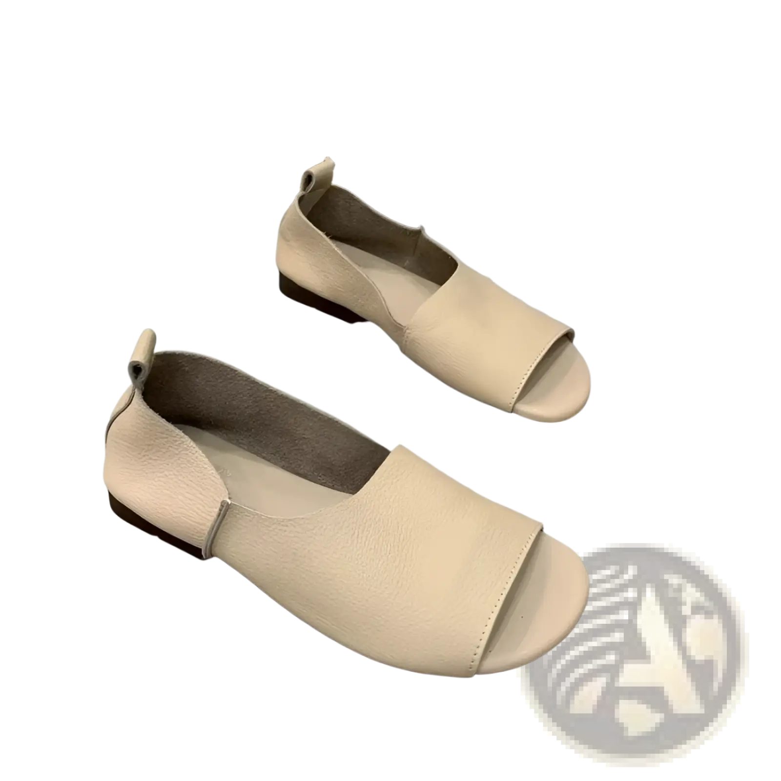 Cream-colored leather slip-on sandals with a minimalist design and soft low-profile sole for casual wear