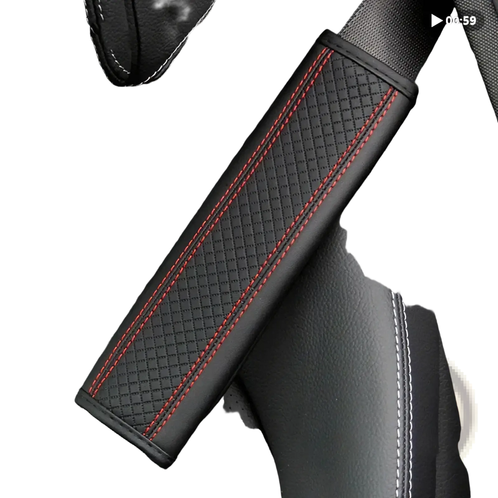 Black leather seat belt cover with red stitching along the edges for added comfort and style in vehicles