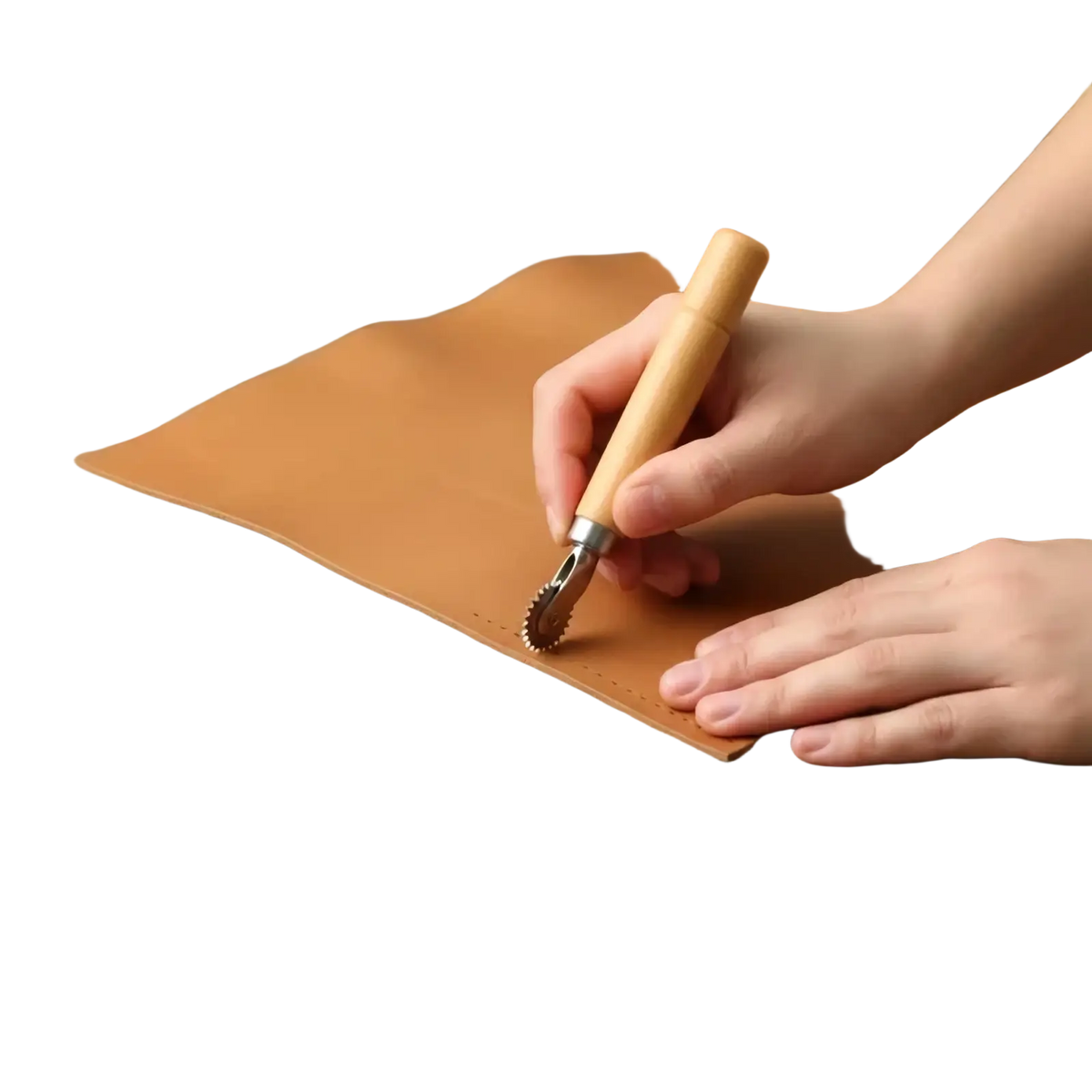 A wooden-handled leather stamping tool with a metal toothed roller head creating perforations on tan leather for diy craft