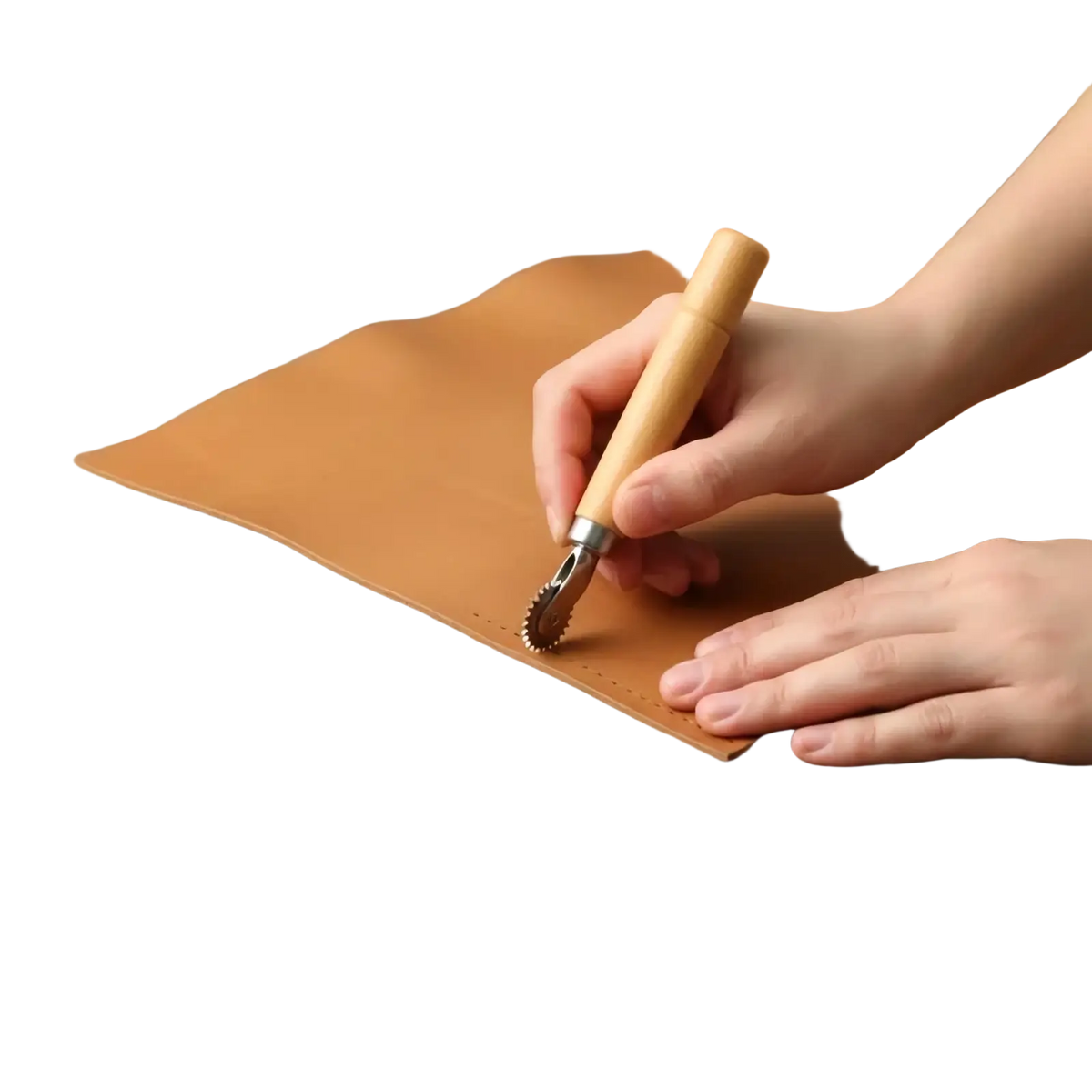 A wooden-handled leather stamping tool with a metallic toothed roller head creating perforations on tan leather for diy crafts
