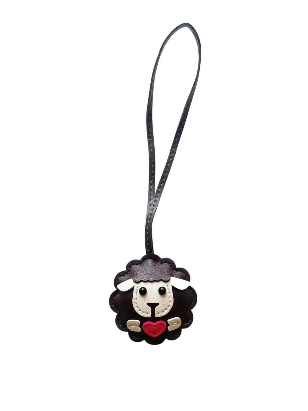 Leather sheep keychain made of black leather with white face, red heart, and gold accents as a cute animal bag charm