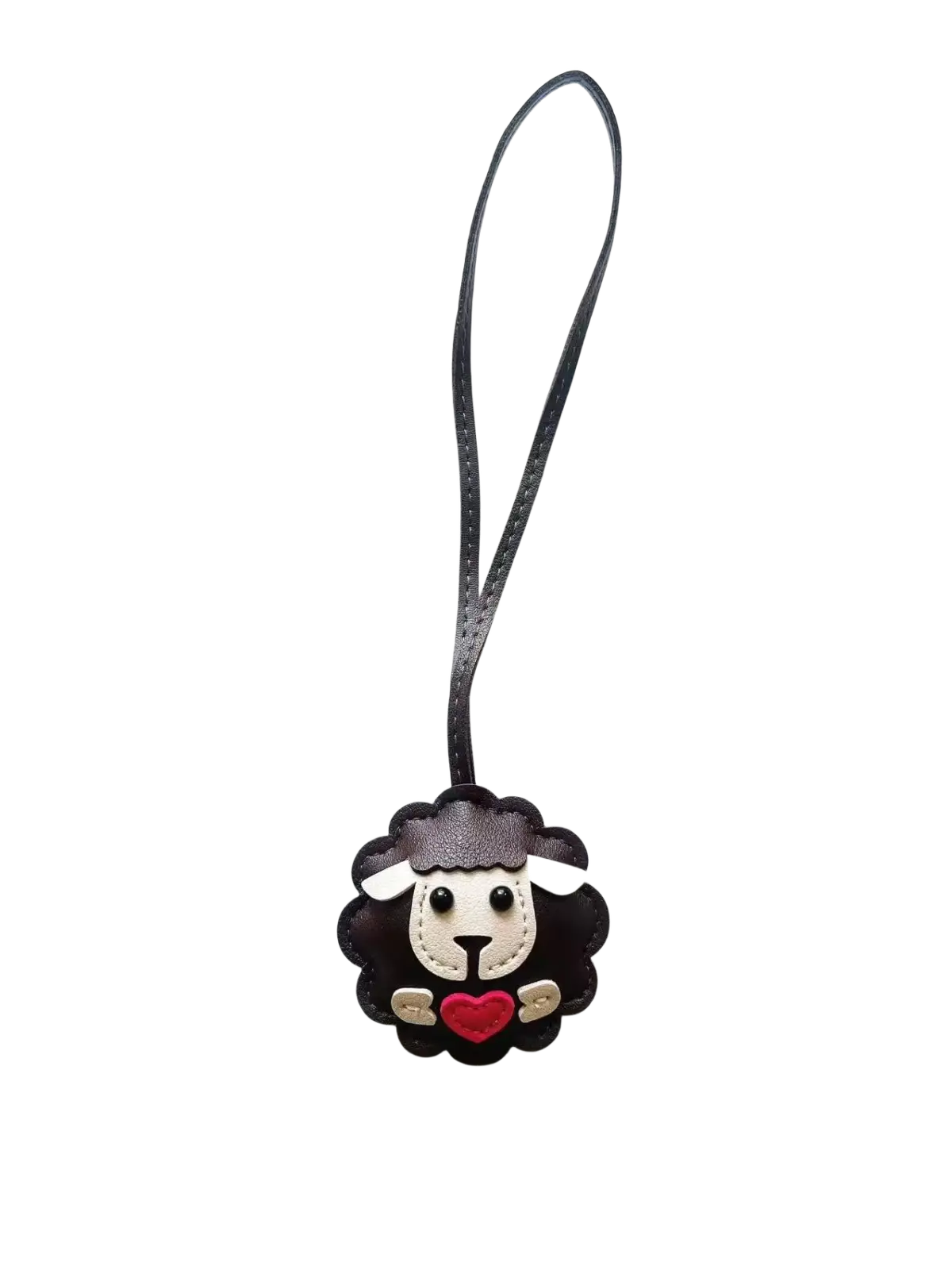 Leather sheep keychain made of black leather with white face, red heart, and gold accents as a cute animal bag charm