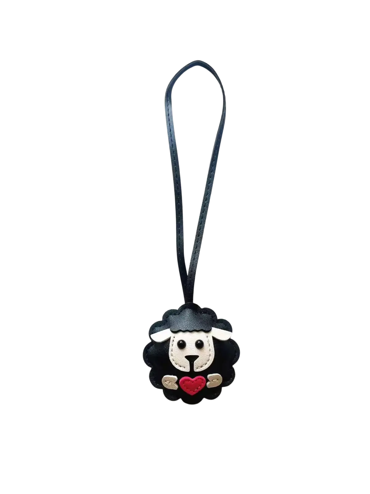 Black leather sheep keychain with white face red heart and silver accents hanging from black strap bag charm