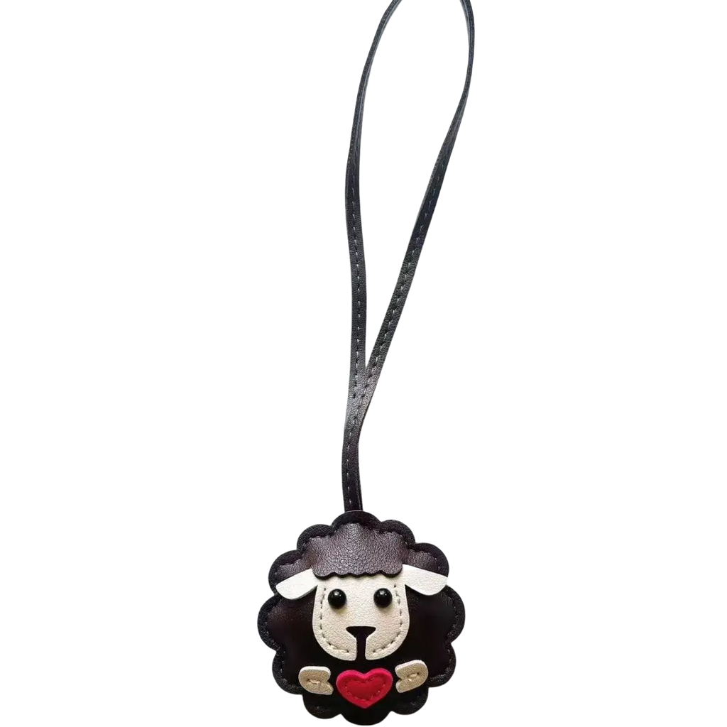 Black leather sheep keychain with white face red heart and stitched details bag charm accessory
