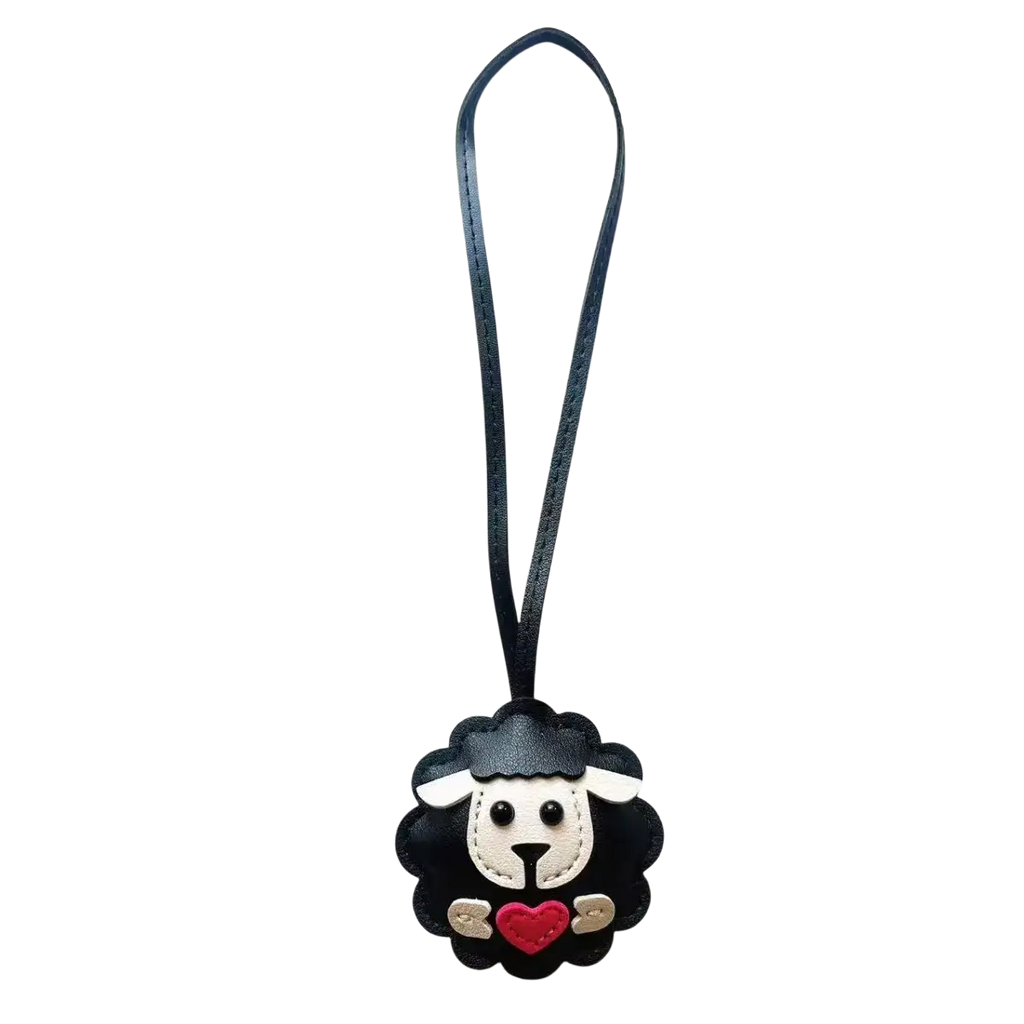 Black leather sheep keychain with white face red heart and stitched details cute animal bag charm accessory