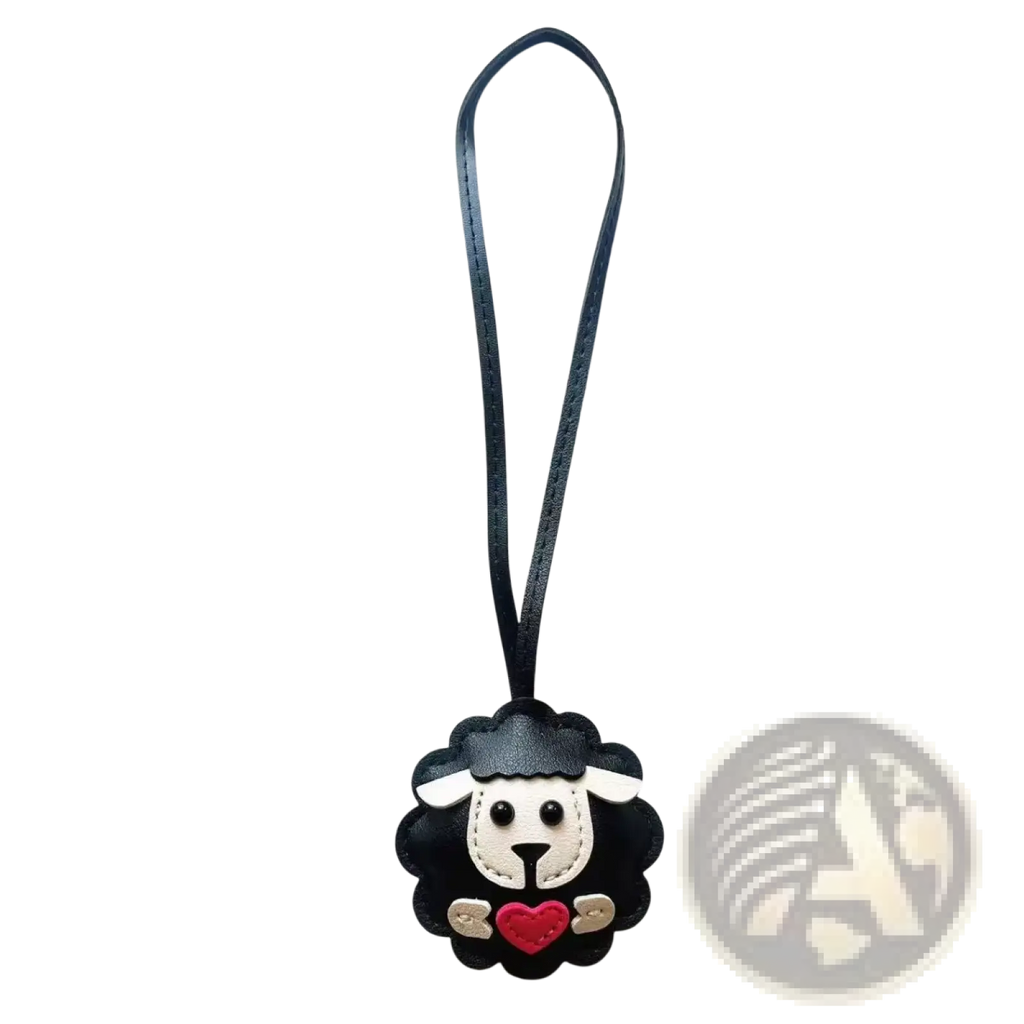 Black leather sheep keychain with white face red heart and stitched details cute animal bag charm accessory