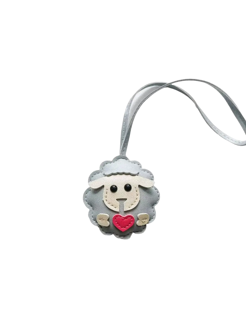 Gray leather sheep keychain with red heart and white face details attached to a matching gray ribbon bag charm
