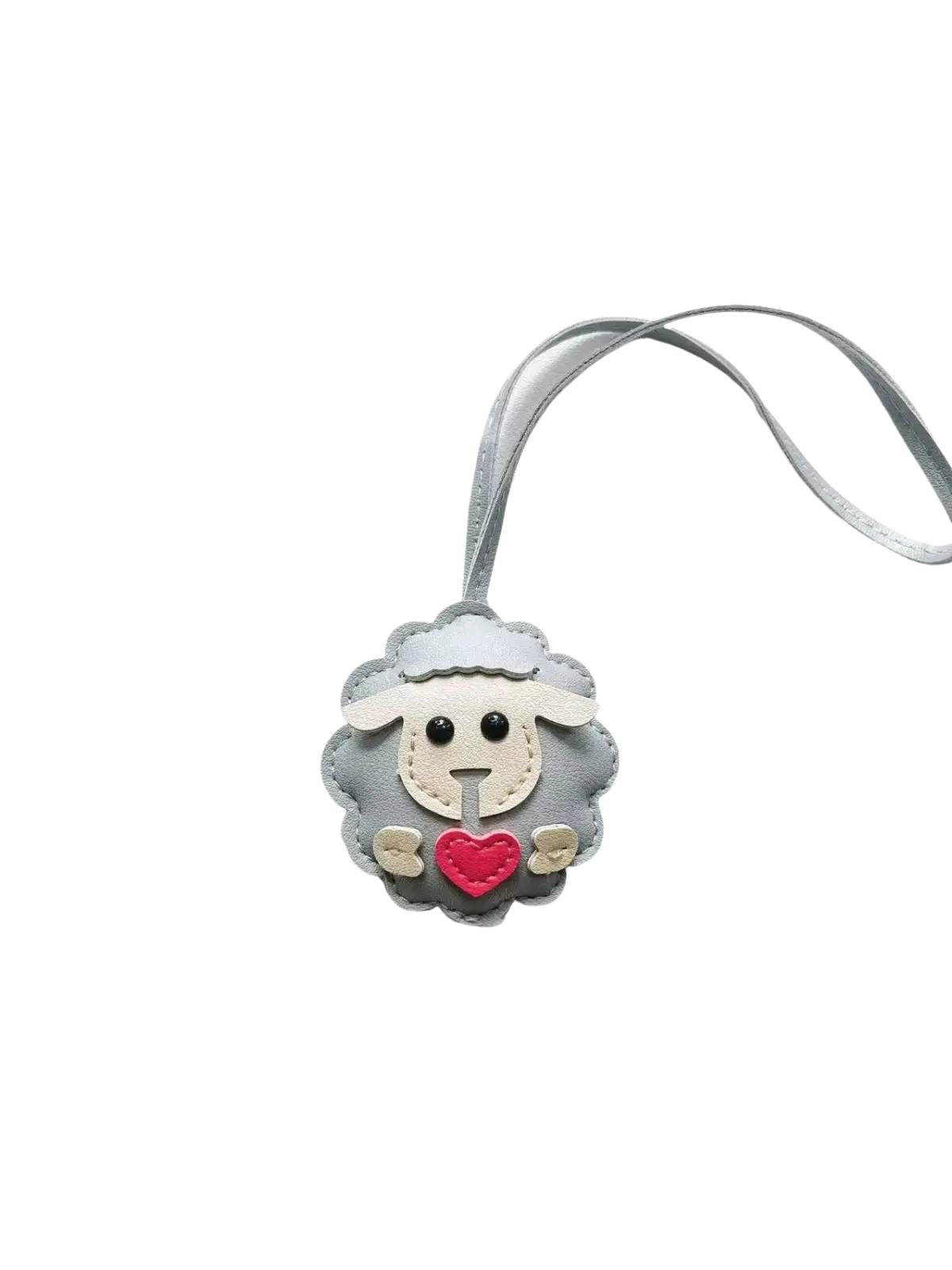 Gray leather sheep keychain with red heart and white face details attached to a matching gray ribbon bag charm