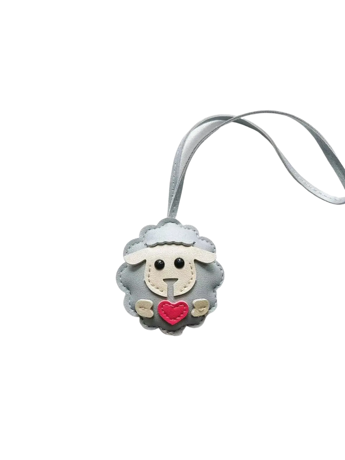 Gray leather sheep keychain with red heart and black button eyes attached to a matching gray strap bag charm