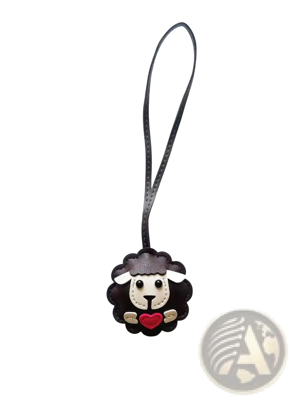 Leather sheep keychain made of black leather with white face, red heart, and gold accents as a cute animal bag charm