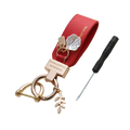 Red leather shell keychain with rose gold metal accents and leaf charms designed as a French style anti loss car charm