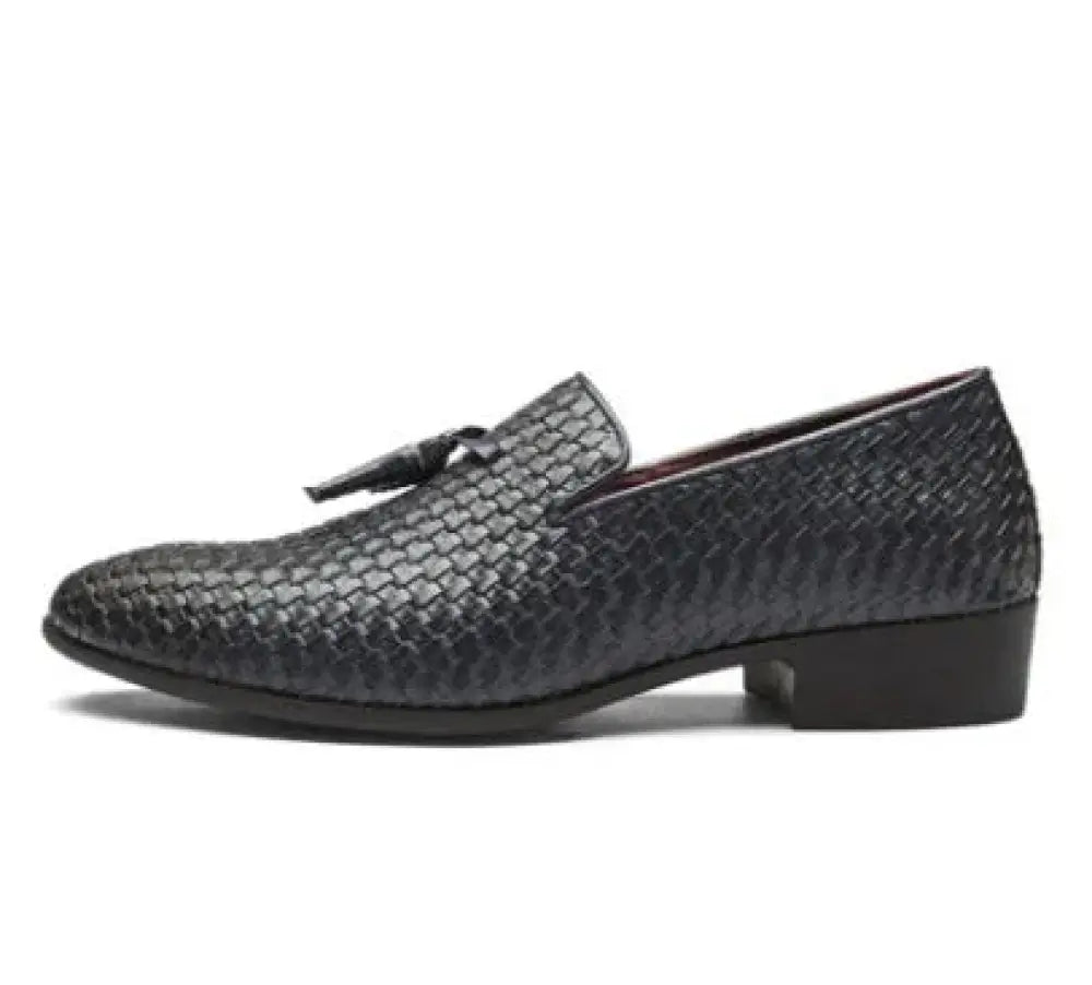 Men’s black woven leather tassel loafer with a low block heel showing front and side details
