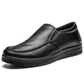 Men’s British leather black slip-on casual shoe with textured surface and stitched detailing