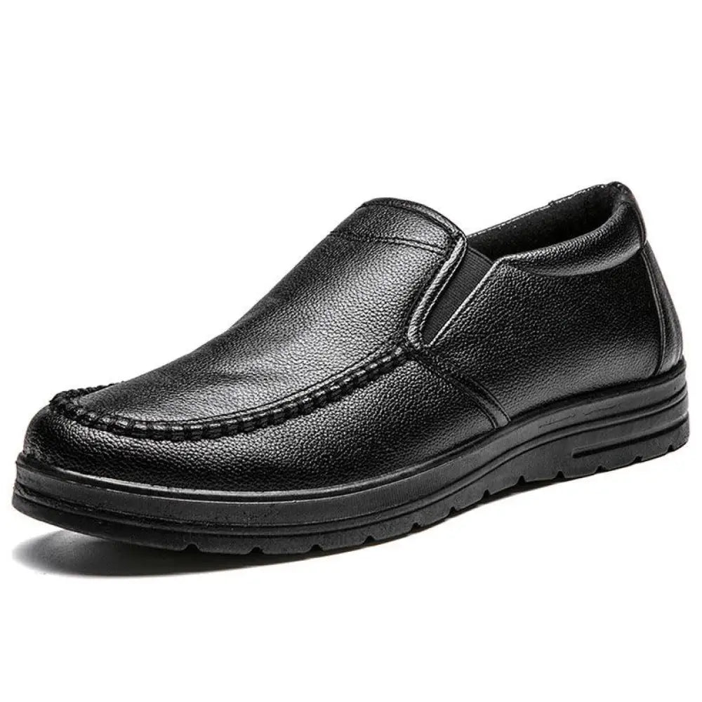 Men’s British leather black slip-on casual shoe with textured surface and stitched detailing
