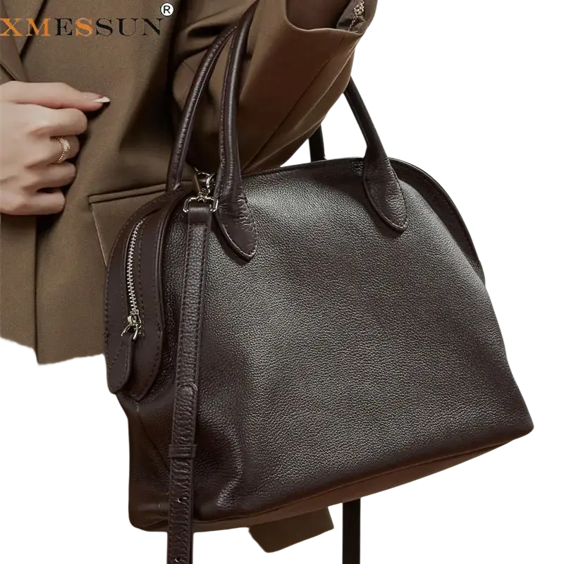 Dark brown cowhide leather shoulder bag with textured surface and top handles ideal for carrying cell phone, from Guangdong province