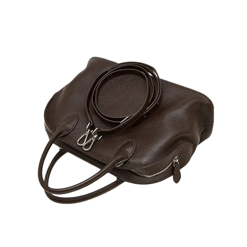 A dark brown cowhide leather shoulder bag with textured surface and silver hardware ideal for cell phone storage from guangdong province