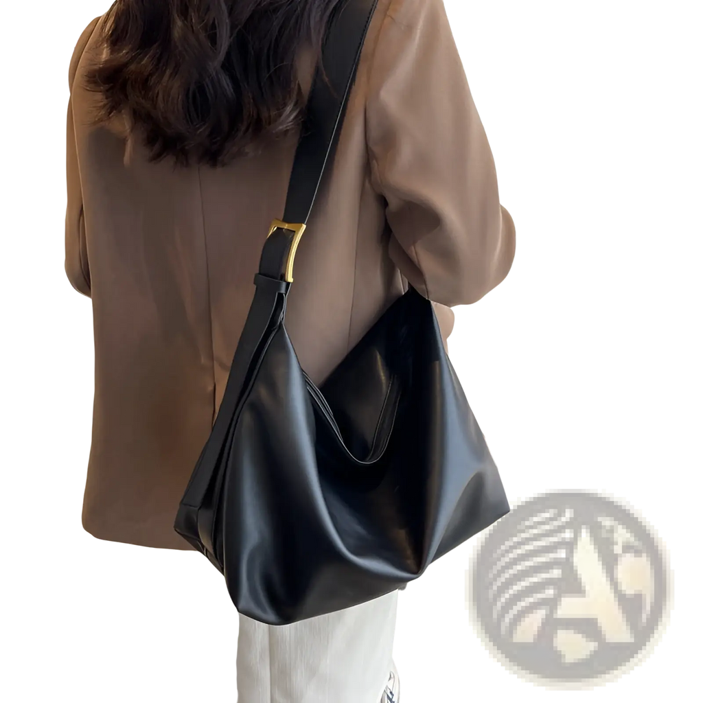 Black faux leather shoulder bag with gold-tone buckle and minimalist design for elegant everyday use