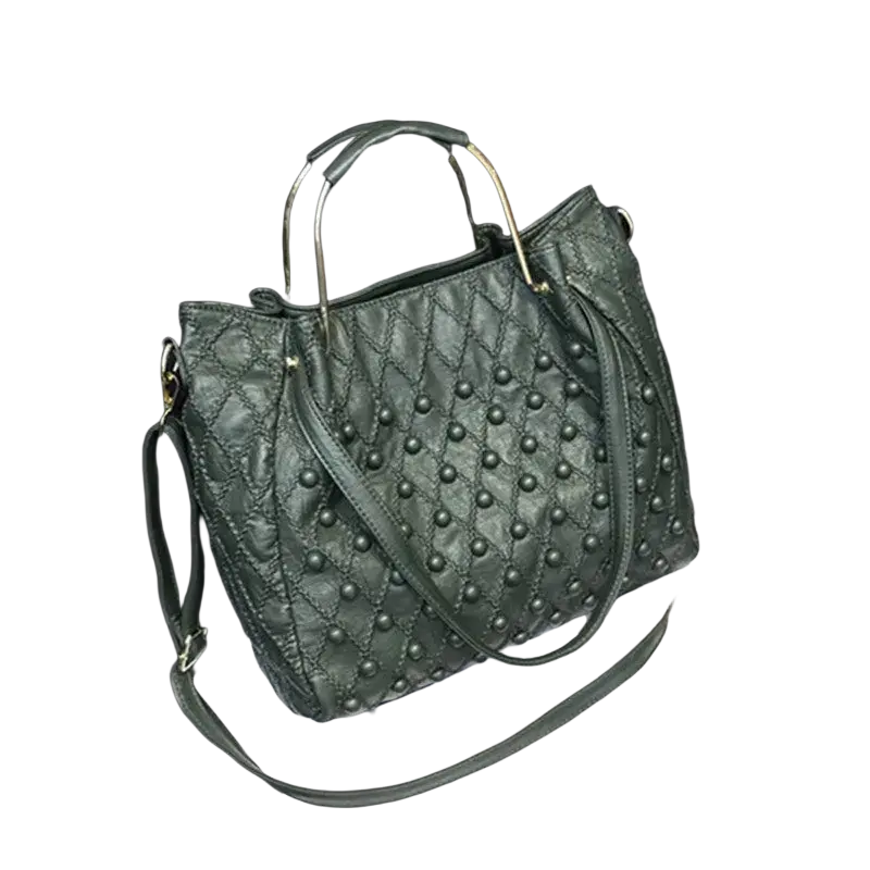 Dark green leather shoulder bag with quilted design, metallic ring handles, black studs, and pocket interior details