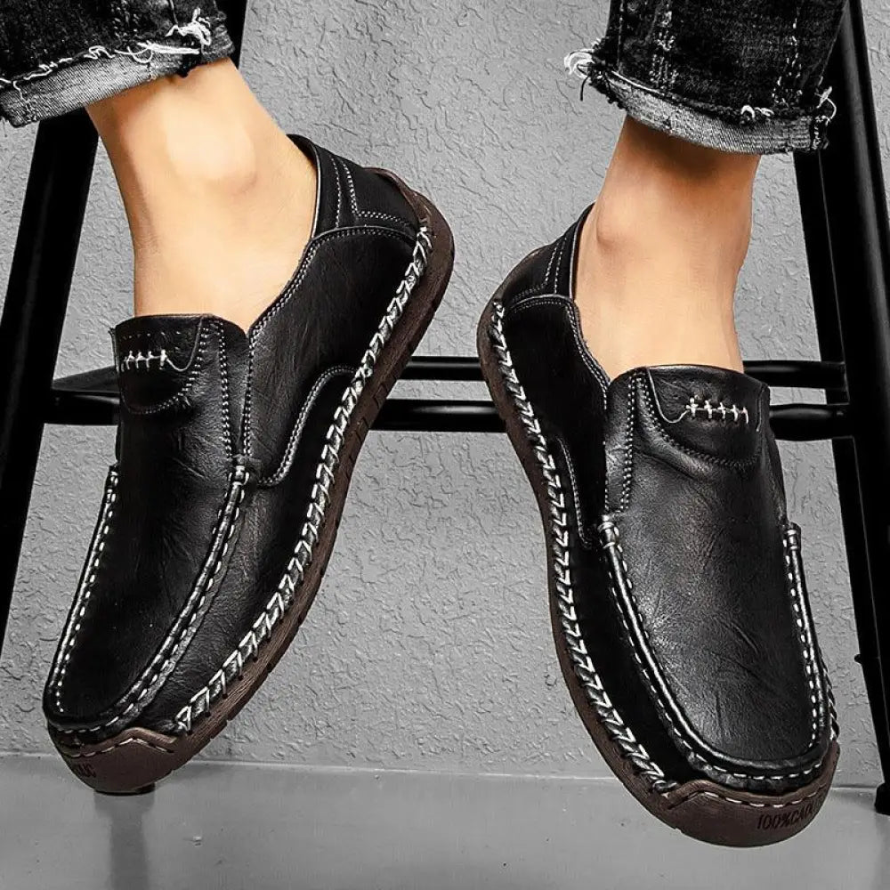 Men’s premium black leather slip-on business loafers with soft sole white stitching and textured sole