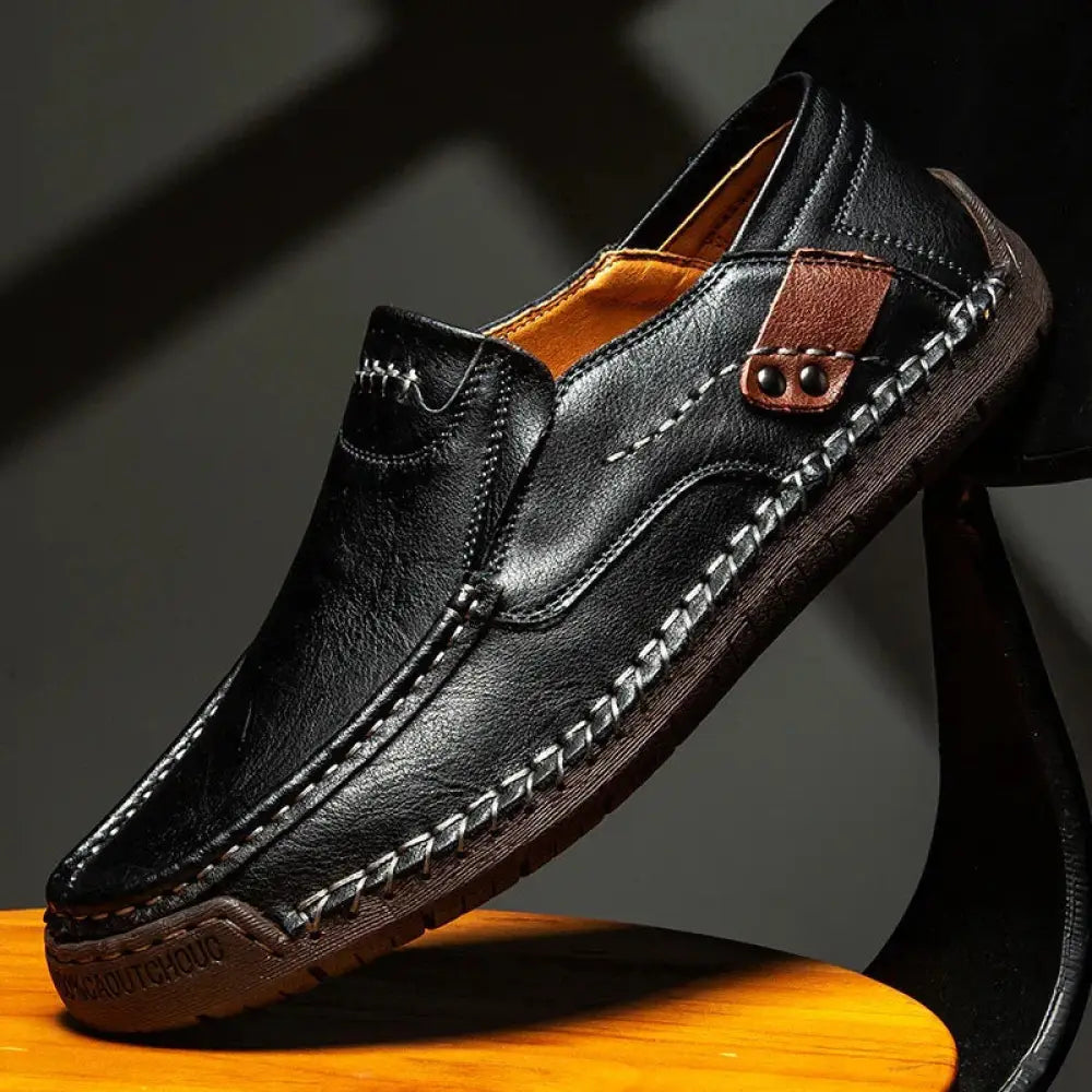 Men’s premium soft sole black leather business loafers with contrasting tan stitching and brown leather side patch