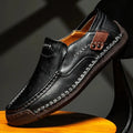 Men’s premium soft sole black leather business loafers with contrasting tan stitching and brown leather side patch
