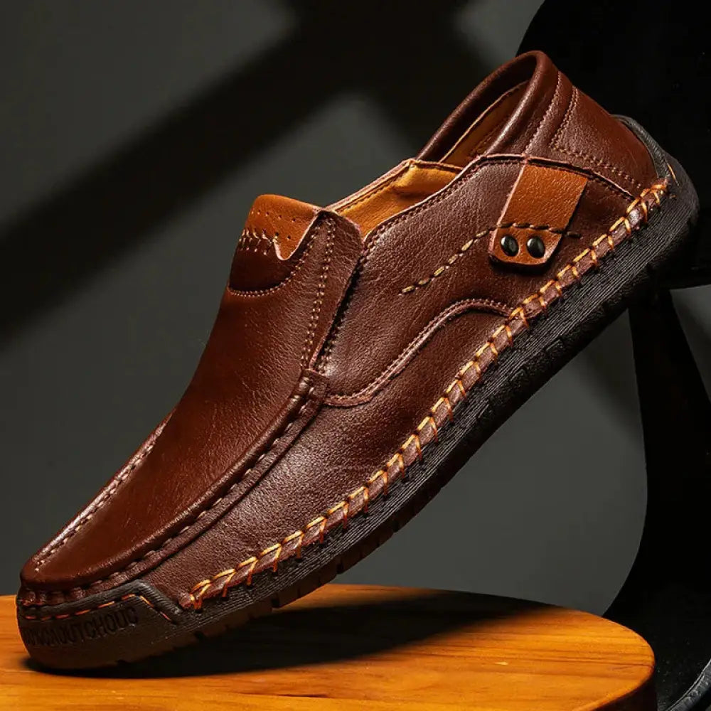 Men’s premium soft sole leather business loafers in brown with visible stitching and a contrasting tan accent panel