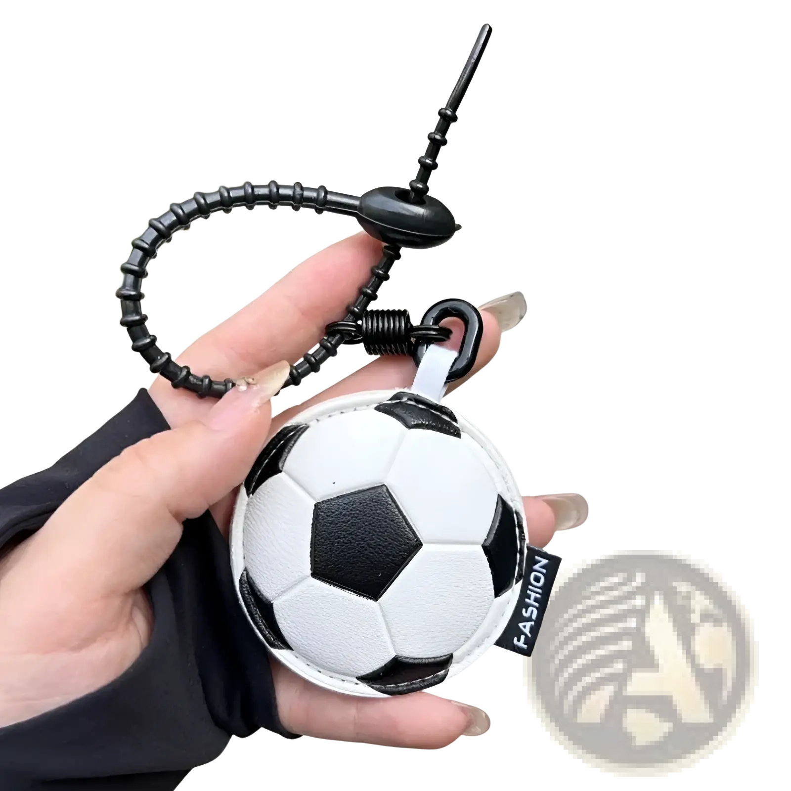 Leather sports ball keychain set bag charm featuring a black and white textured leather soccer ball with coiled strap and spring mechanism