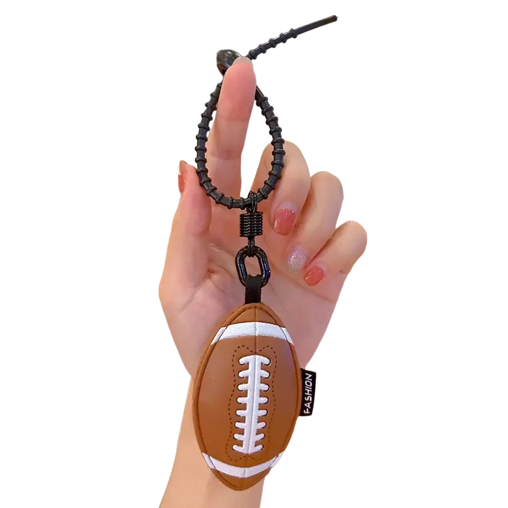 Leather sports ball keychain set bag charm featuring a brown and white football shape with black elastic loop