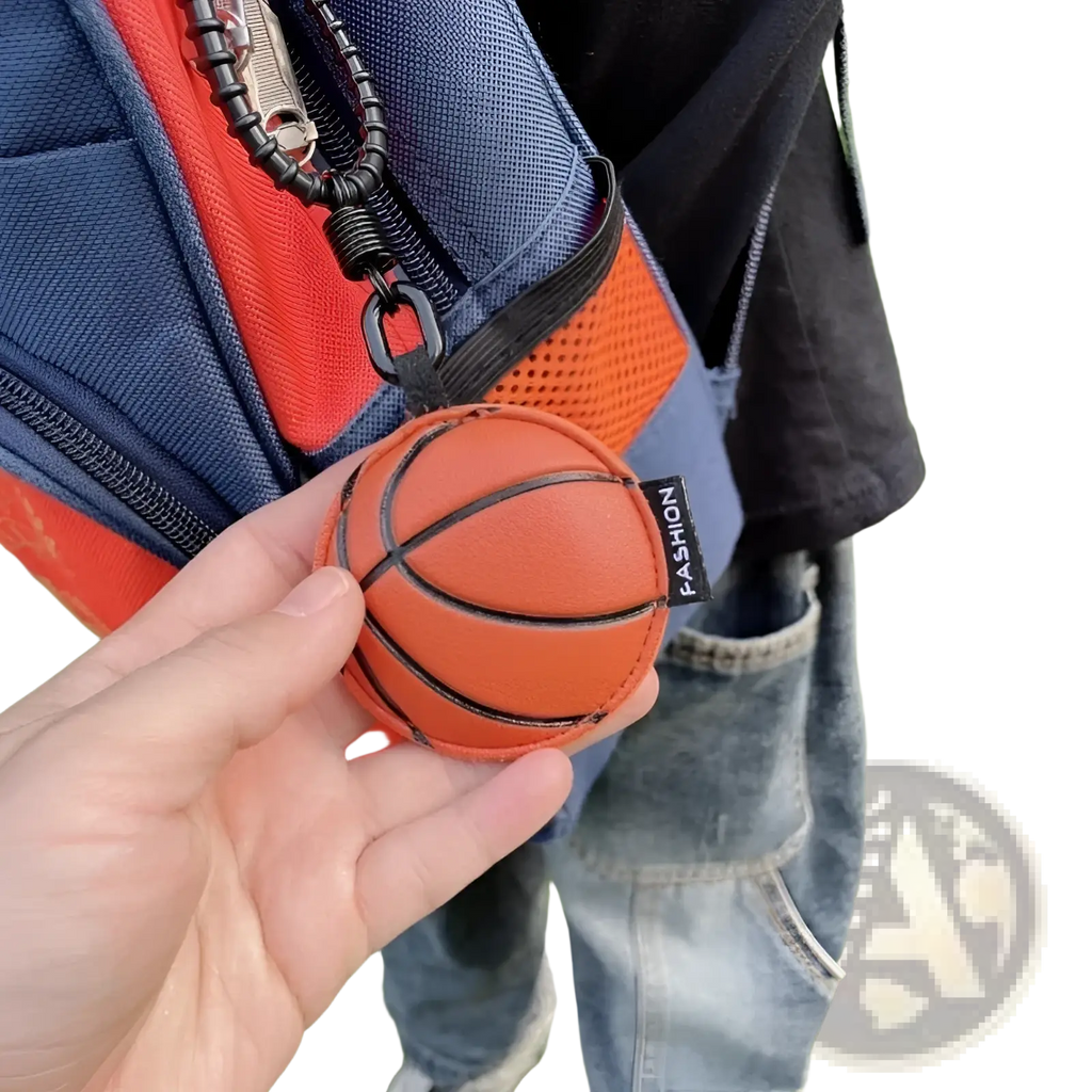Leather sports ball keychain set bag charm featuring an orange basketball-shaped leather keychain with black stitching and a fashion tag