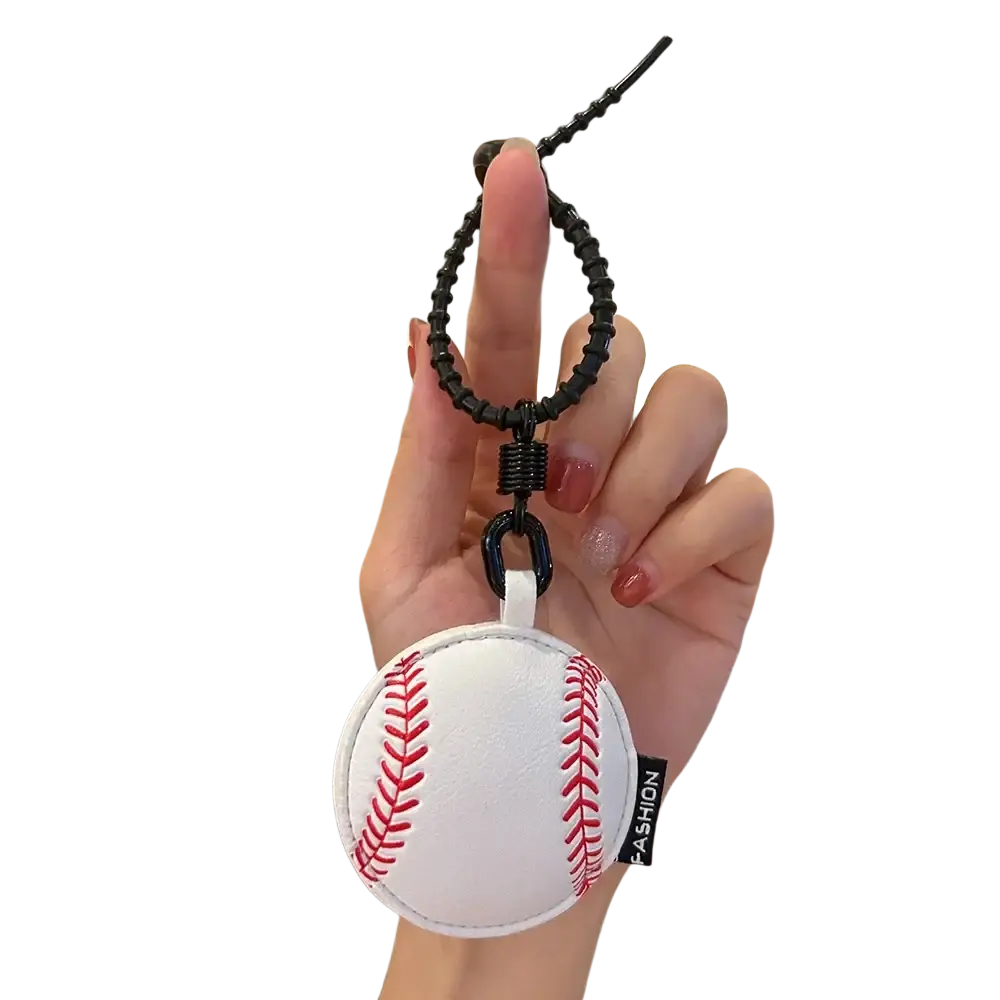 Leather sports ball keychain set bag charm featuring a white baseball shaped keychain with red stitching and black cord