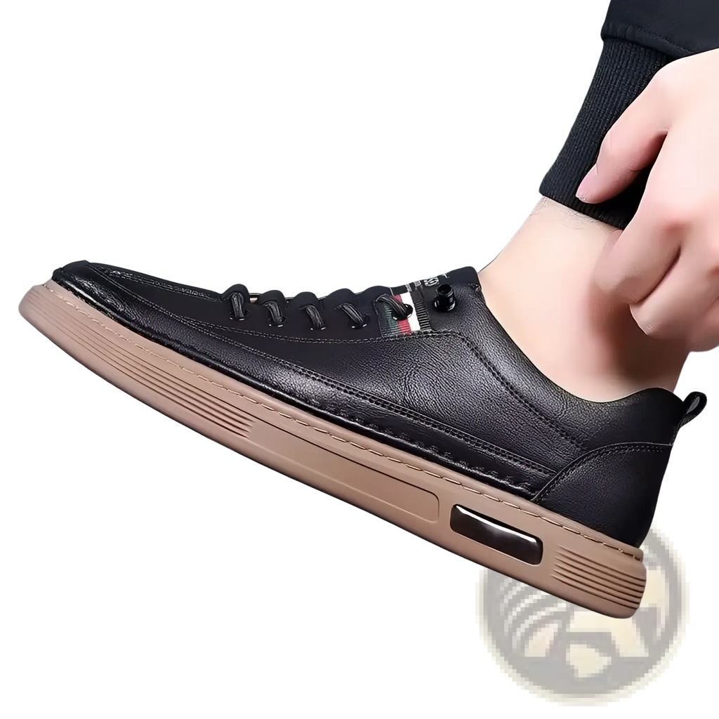 Black leather casual sneaker with tan rubber sole and air cushioning unit for cushioned fashion sports use