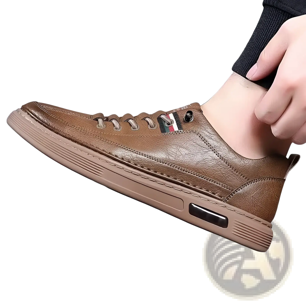 Brown leather sports sneaker with textured upper, tan rubber sole, and side air cushioning for casual fashion use