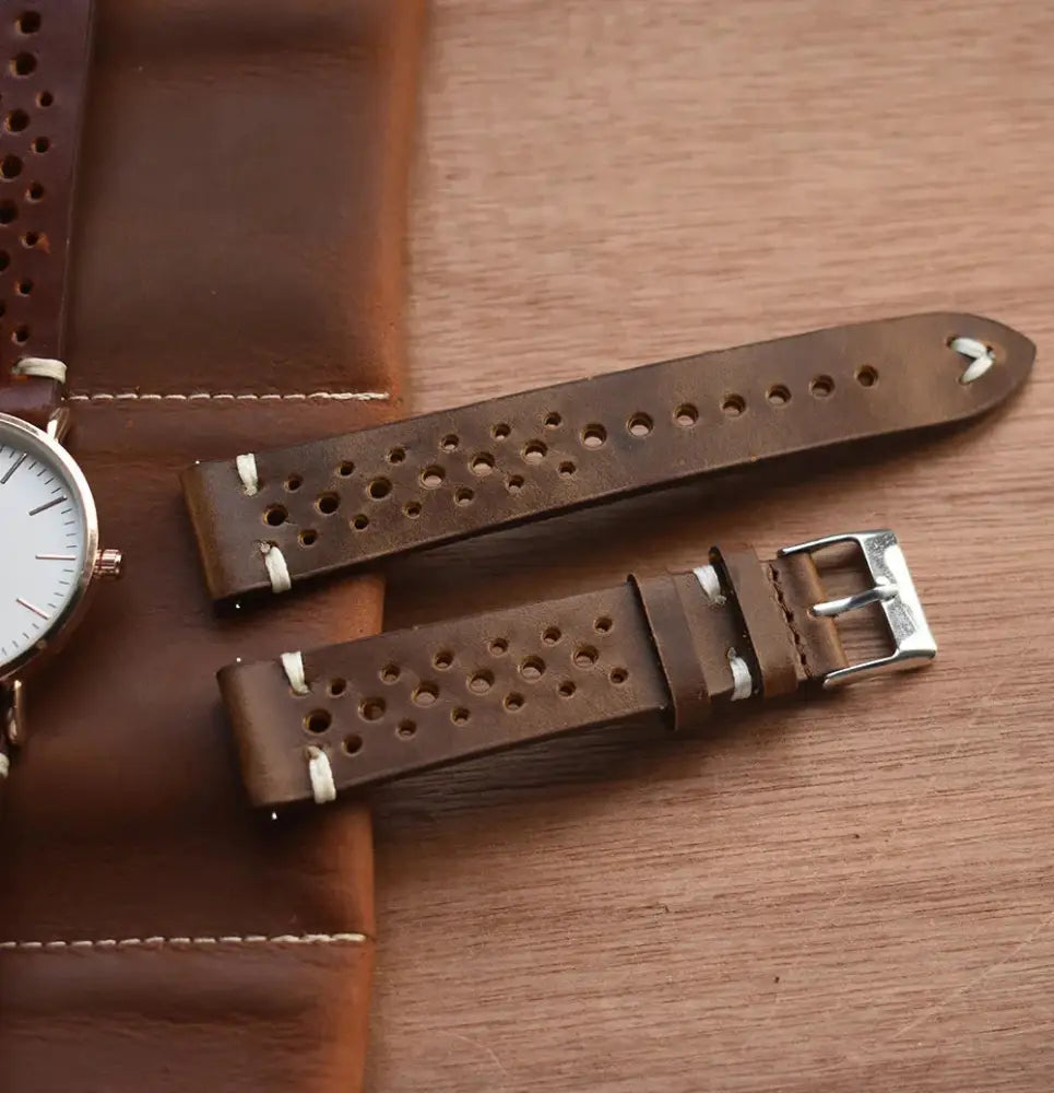 Handmade perforated crazy horse leather watch strap in brown with silver buckle and breathable design