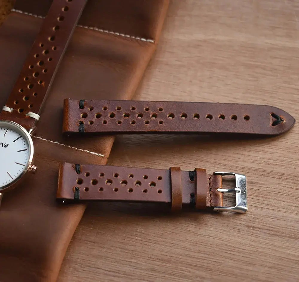Handmade perforated crazy horse leather watch strap in brown with silver buckle and durable accessory design