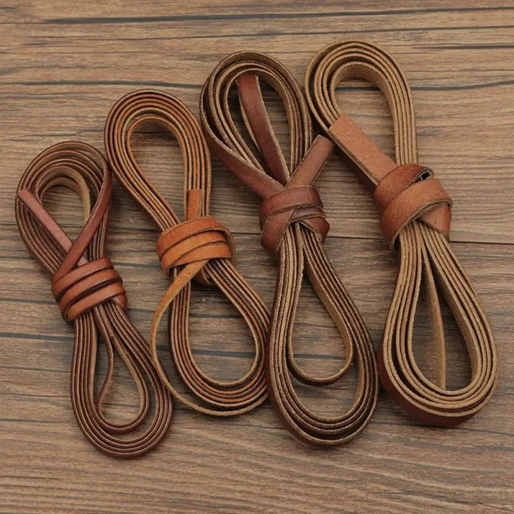 Handmade genuine leather brown shoelaces neatly coiled and tied with matching straps for diy crafting projects