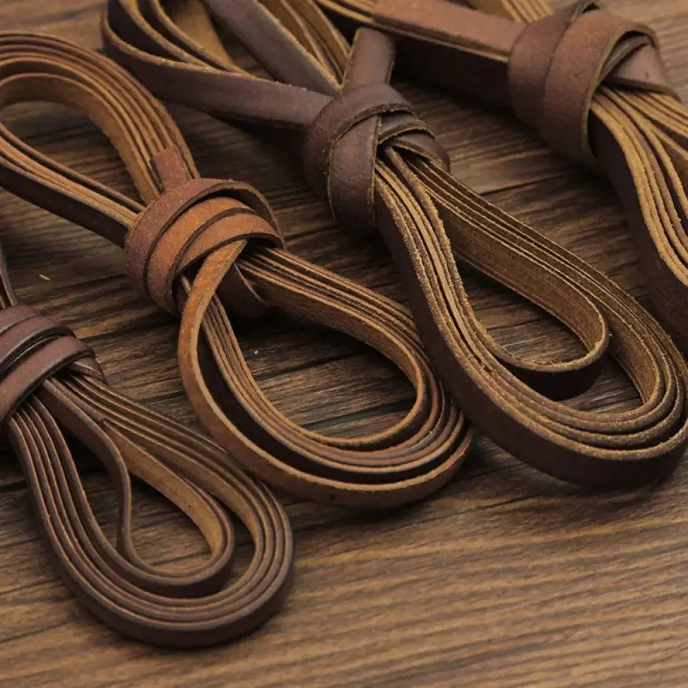 Handmade genuine brown leather cord shoelaces neatly tied in loops for diy crafting projects