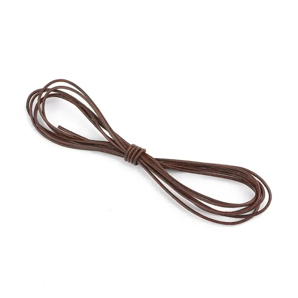 Handmade genuine brown leather cord neatly coiled and tied in a knot for diy crafting projects